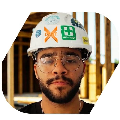 DantX crew working on a timber-framed build