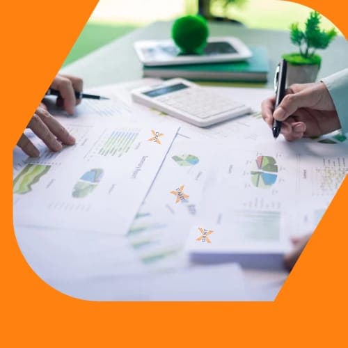 A builder drawing detailed plans on a blueprint — the costing starts here